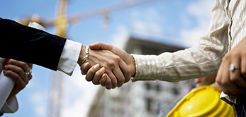 Two female architects handshaking, selective focus, canon 1Ds mark III